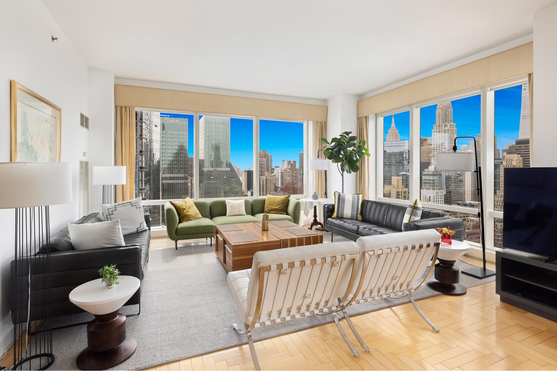 a living room with furniture and a flat screen tv