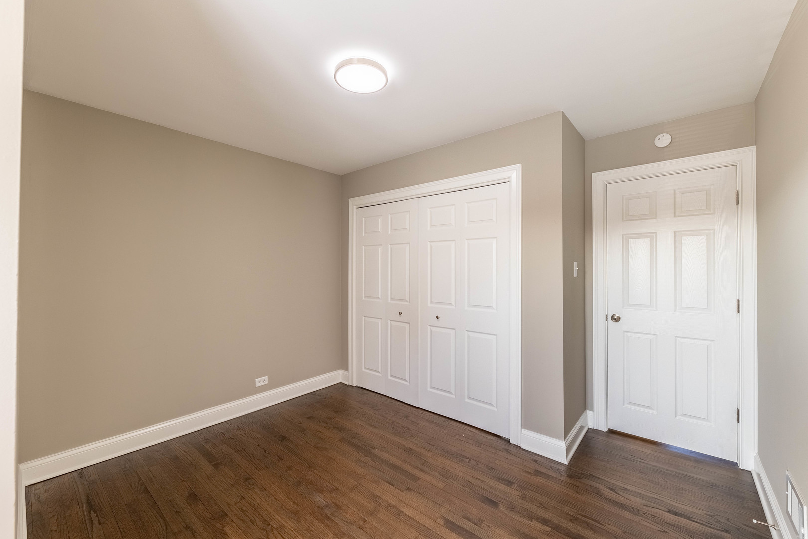 7914 South Troy Street Chicago, IL 60652 - Photo 15 of 35 a view of an empty room with wooden floor