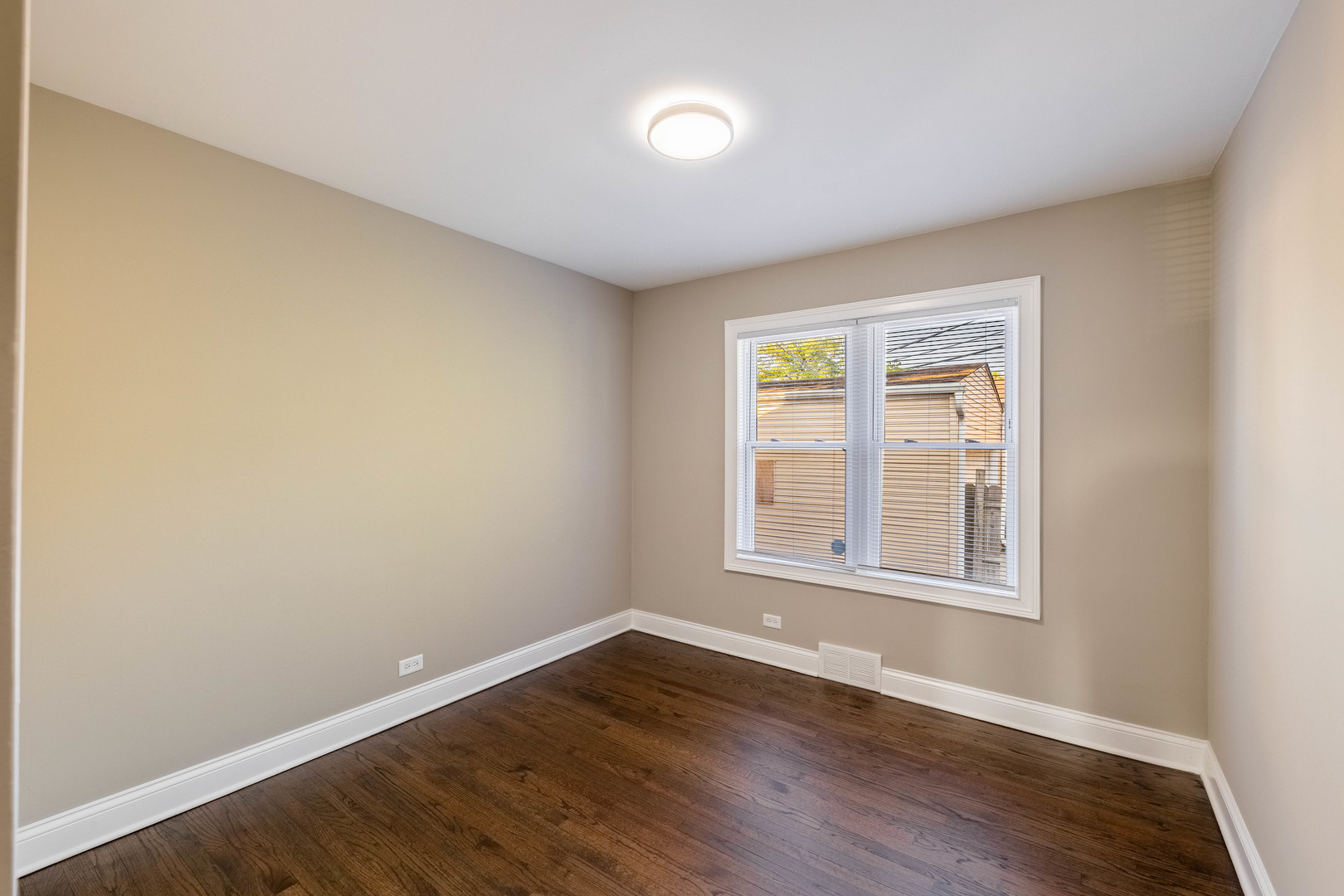 7914 South Troy Street Chicago, IL 60652 - Photo 16 of 35 an empty room with wooden floor and windows