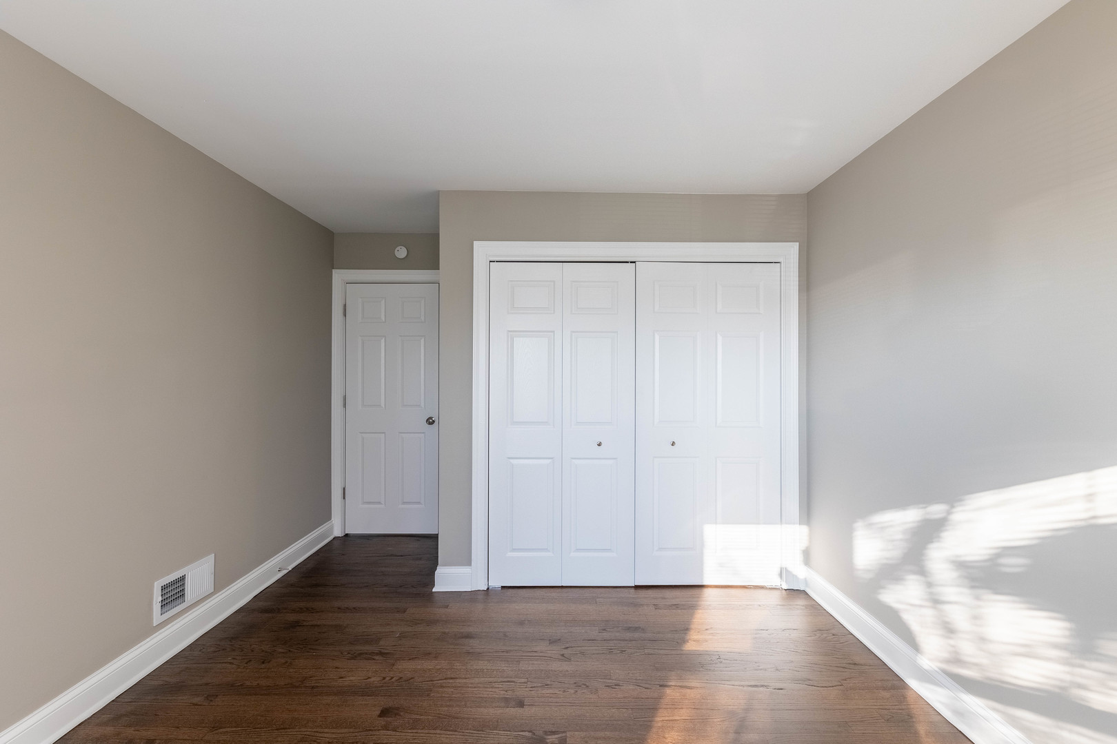 7914 South Troy Street Chicago, IL 60652 - Photo 19 of 35 a view of an empty room and wooden floor