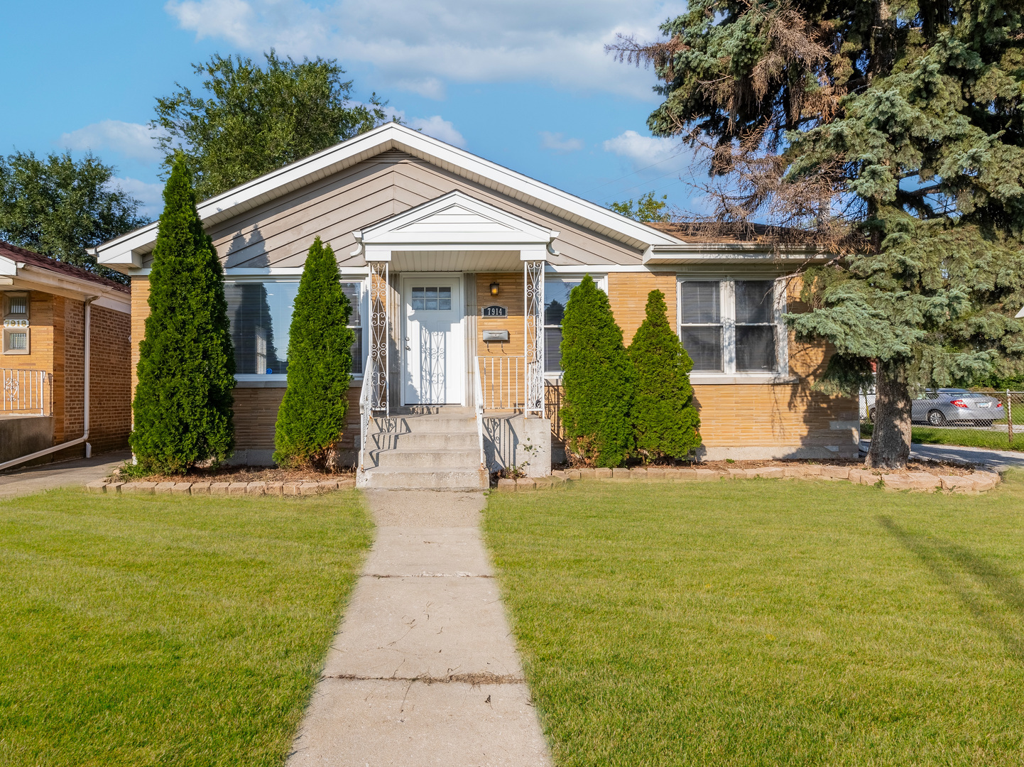 7914 South Troy Street Chicago, IL 60652 - Photo 35 of 35 a front view of a house with a yard