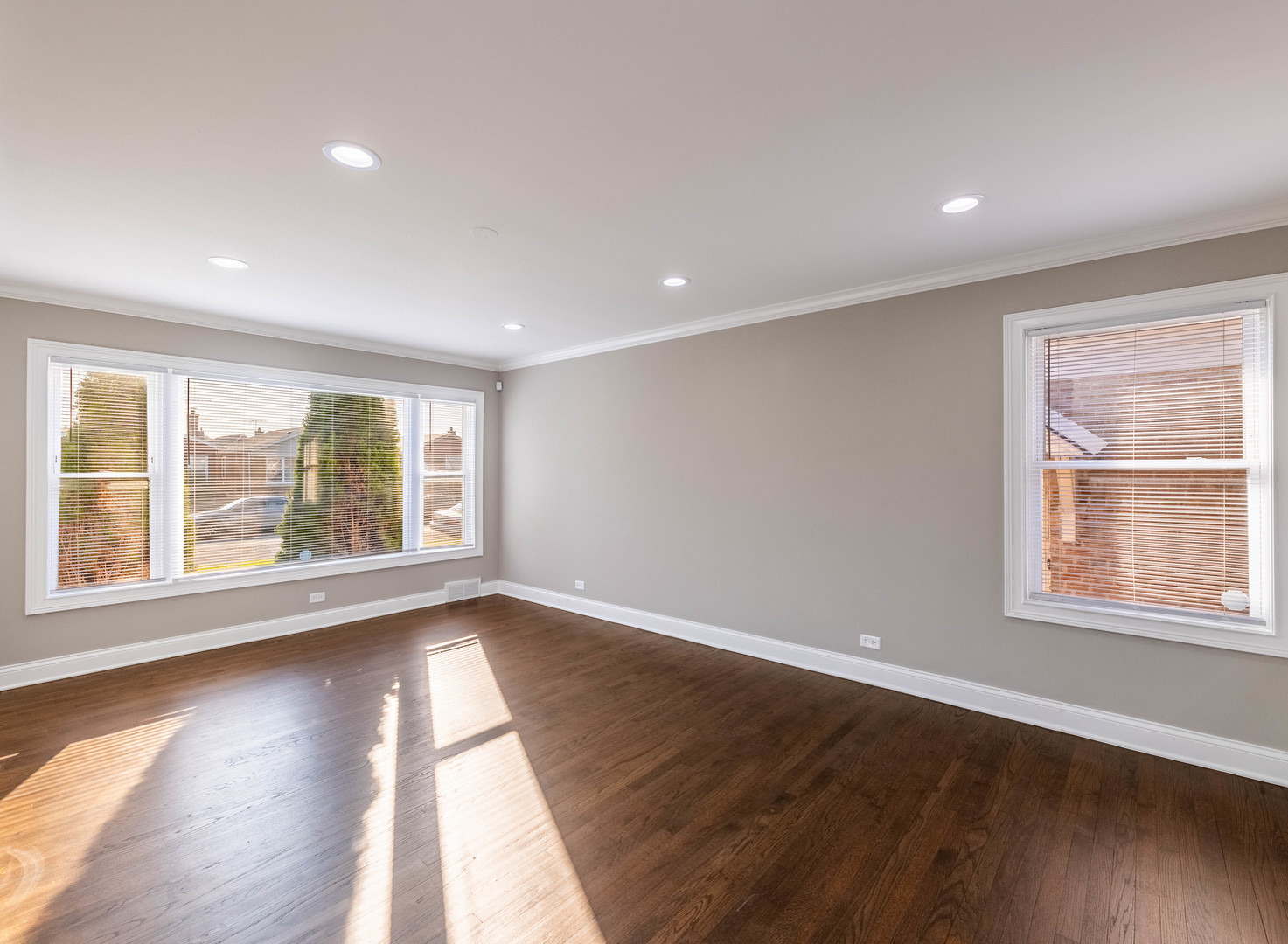7914 South Troy Street Chicago, IL 60652 - Photo 6 of 35 an empty room with wooden floor and windows