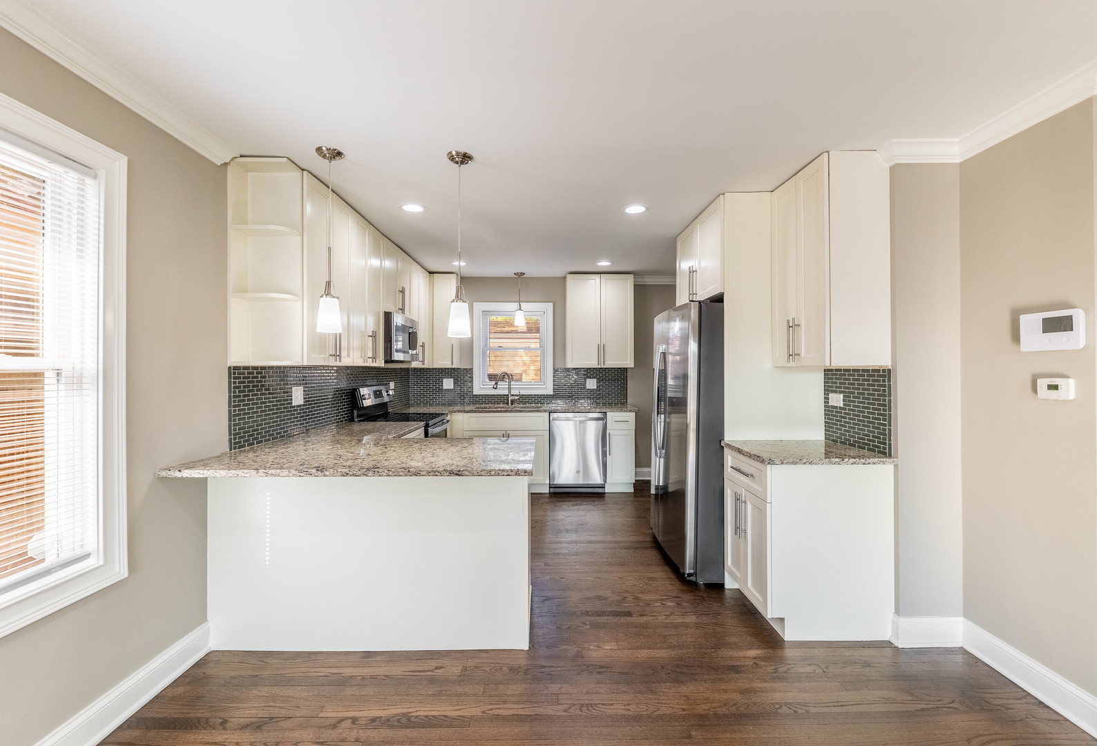 7914 South Troy Street Chicago, IL 60652 - Photo 7 of 35 a kitchen with stainless steel appliances granite countertop a refrigerator and a stove top oven