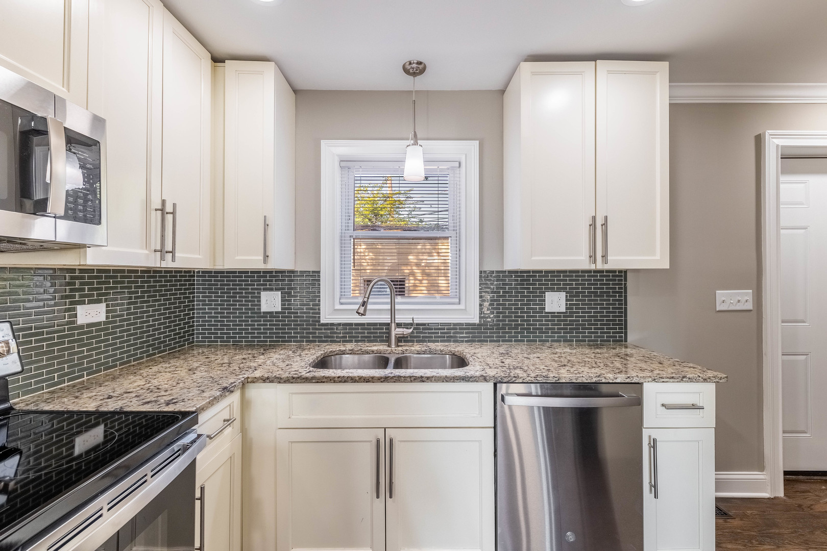 7914 South Troy Street Chicago, IL 60652 - Photo 9 of 35 a kitchen with granite countertop a sink stove and cabinets