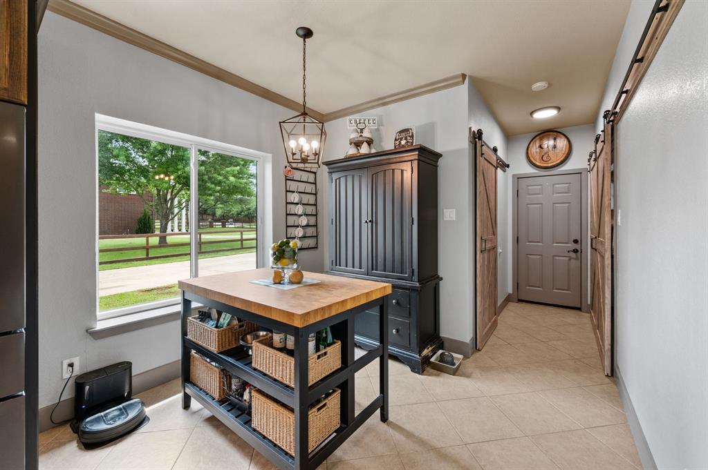 508 Chandler Road Keller, TX 76248 - Photo 12 of 39 a room with pool table and a chandelier