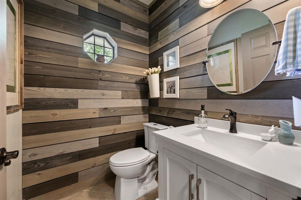 508 Chandler Road Keller, TX 76248 - Photo 15 of 39 a bathroom with a sink a mirror and a toilet