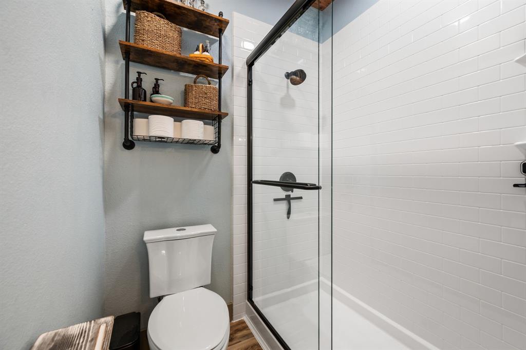 508 Chandler Road Keller, TX 76248 - Photo 20 of 39 a white toilet sitting next to a bathroom sink