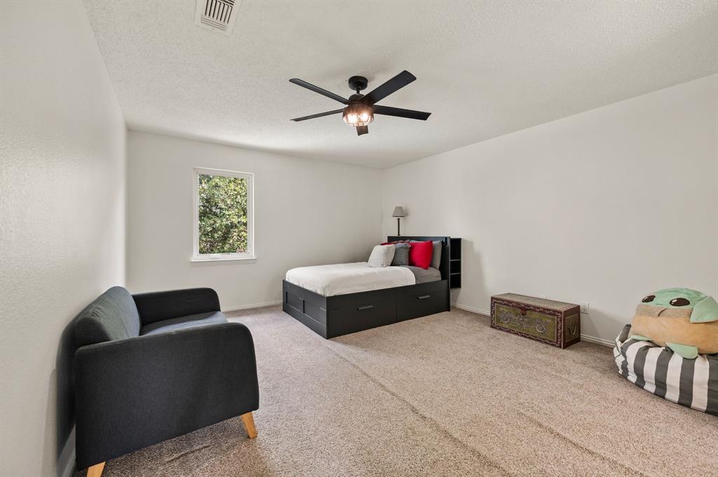 508 Chandler Road Keller, TX 76248 - Photo 21 of 39 a bedroom with furniture and a window