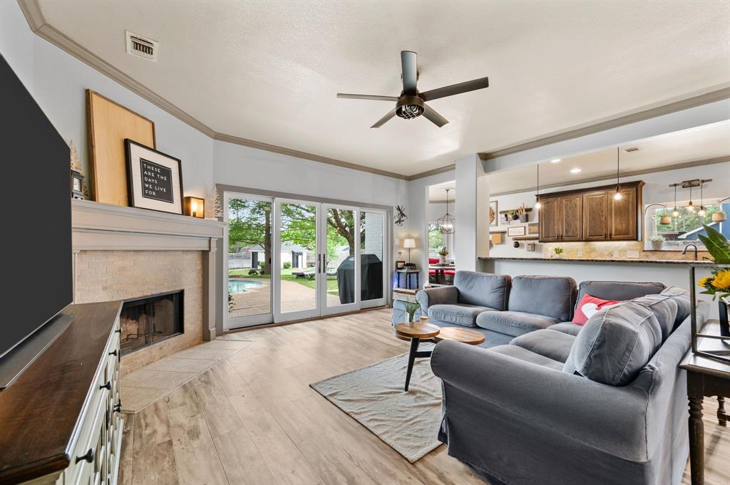 508 Chandler Road Keller, TX 76248 - Photo 6 of 39 a living room with furniture and a fireplace