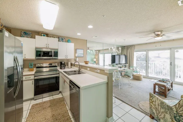 a kitchen with counter top space and stainless steel appliances
