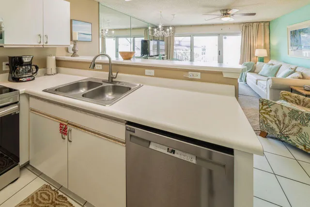 a kitchen with a sink and a window