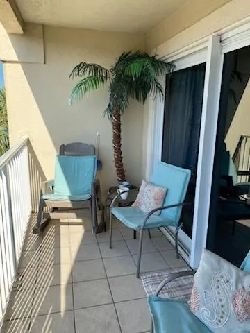 a view of a room with furniture and a potted plant