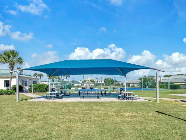 a view of a swimming pool and lounge chair