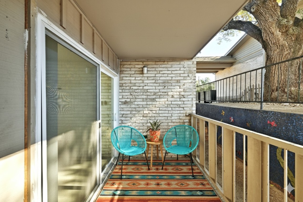 1304 Summit Street, Unit 102 Austin, TX 78741 - Photo 12 of 20 a balcony view with couple of chairs