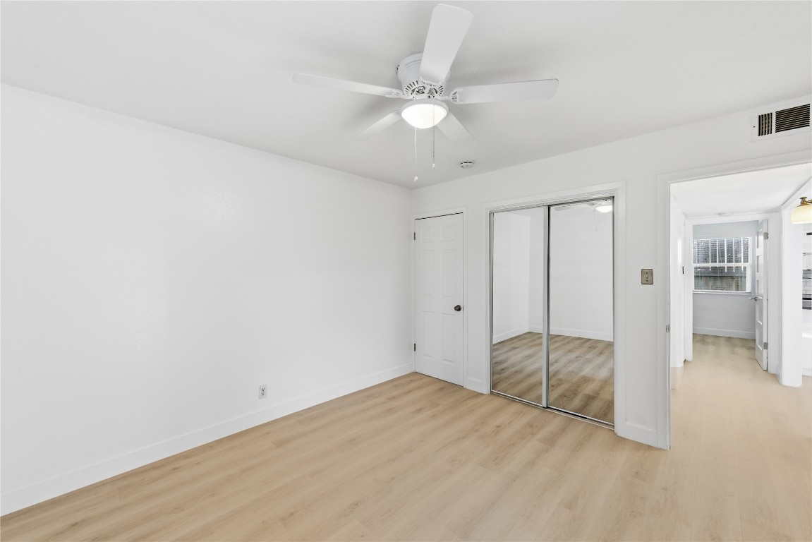 1304 Summit Street, Unit 102 Austin, TX 78741 - Photo 15 of 20 wooden floor in an empty room