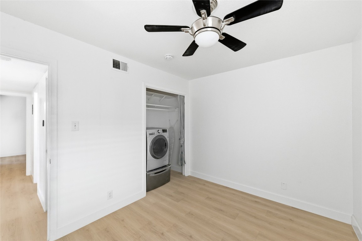 1304 Summit Street, Unit 102 Austin, TX 78741 - Photo 16 of 20 a view of a storage & utility room with a washer dryer