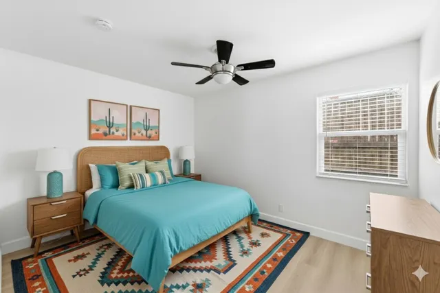 a bedroom with a bed and a window