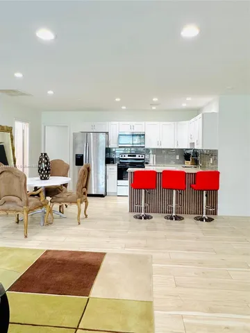 a living room with furniture and a table