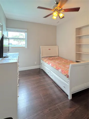 a room with a bed and a window