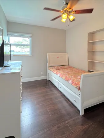 a room with a bed and a window