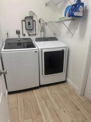 a utility room with dryer and washer