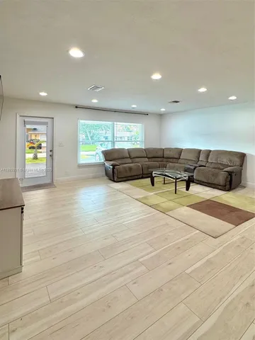 a lobby with furniture and window