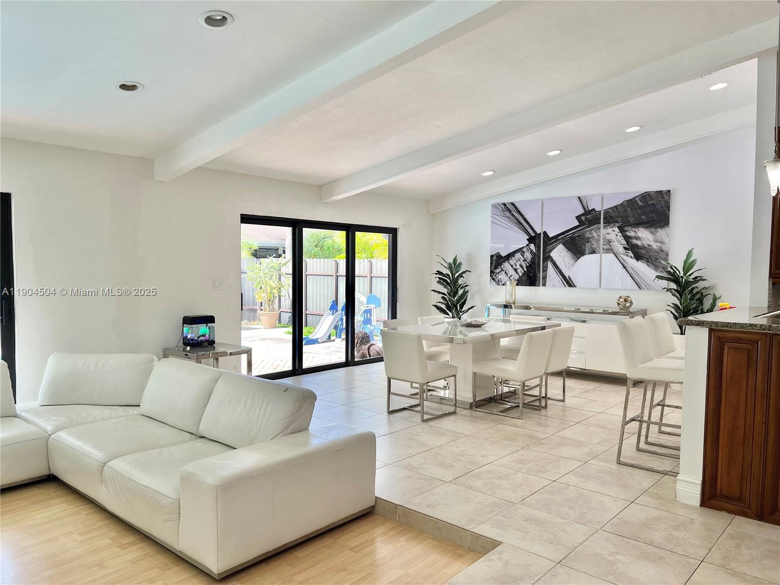 11104 Southwest 139th Court Miami, FL 33186 - Photo 22 of 56 a living room with furniture and a large window