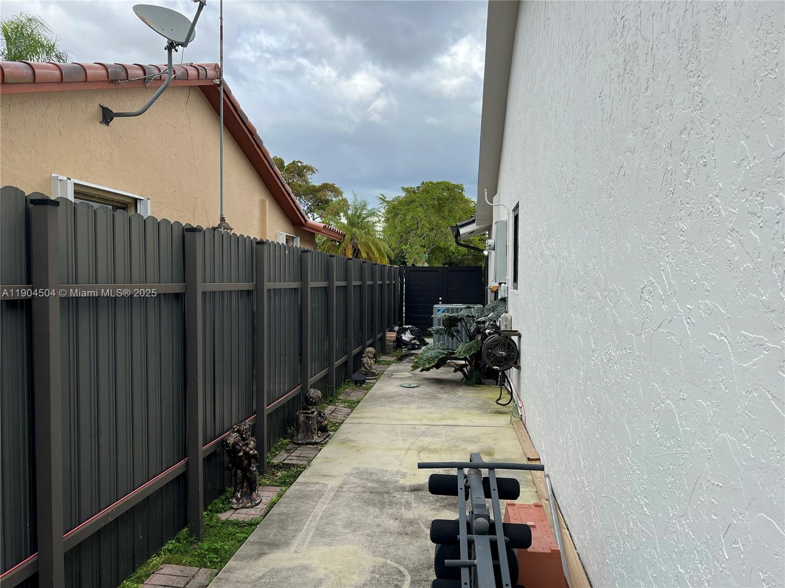 11104 Southwest 139th Court Miami, FL 33186 - Photo 34 of 56 a view of a balcony with chairs and wooden floor