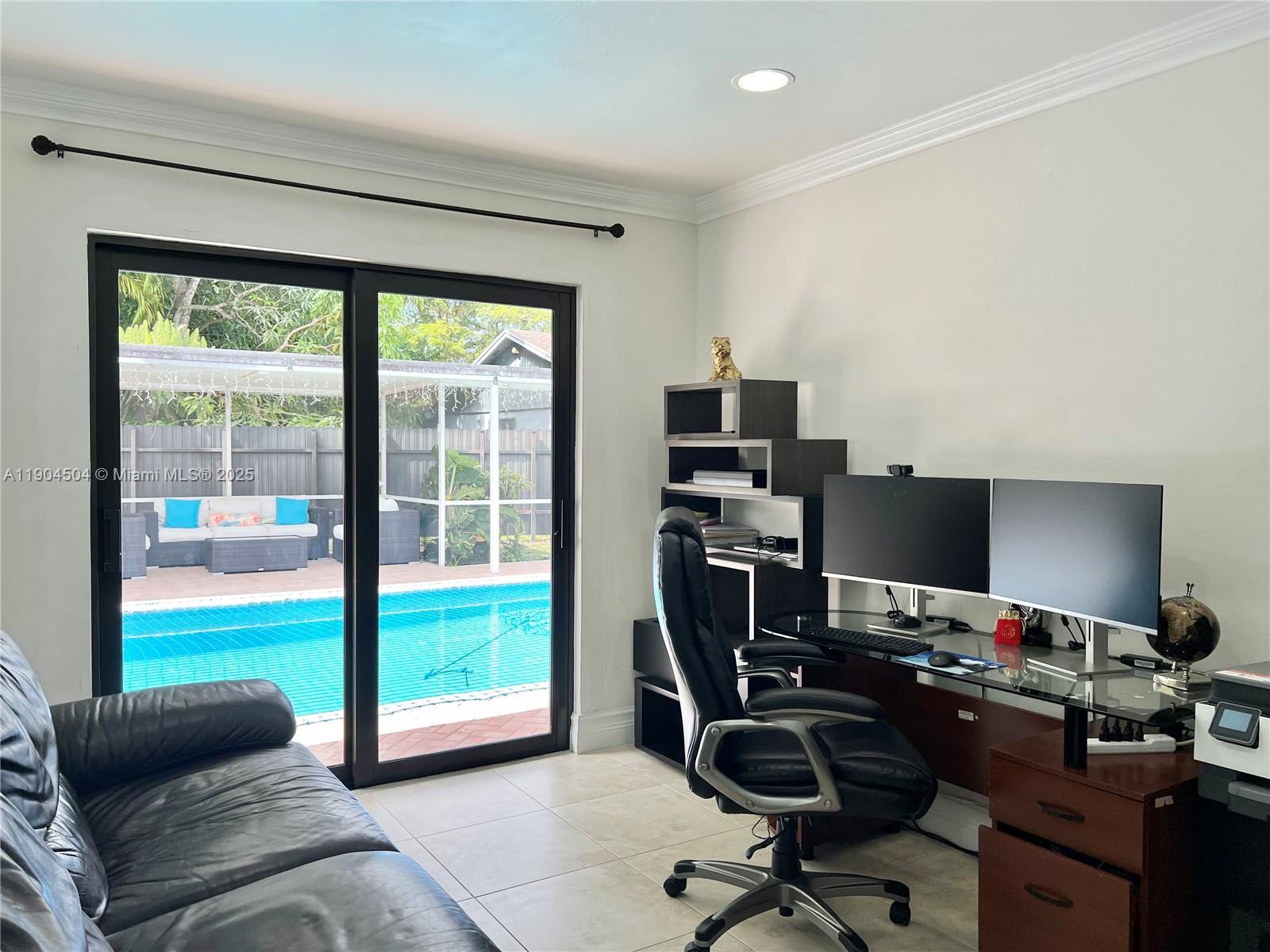 11104 Southwest 139th Court Miami, FL 33186 - Photo 37 of 56 a view of a workspace with furniture and a window