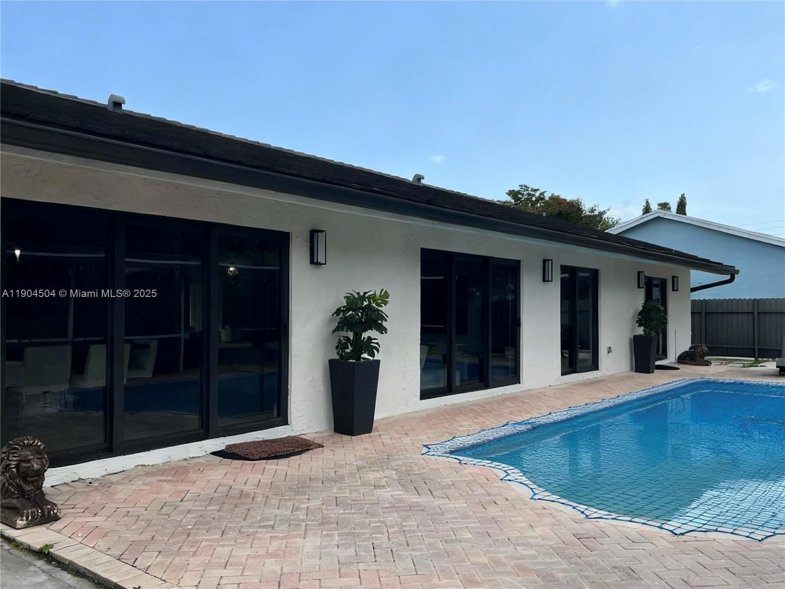 11104 Southwest 139th Court Miami, FL 33186 - Photo 51 of 56 a view of a house with a patio