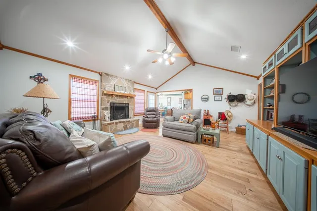 a large kitchen with lots of counter space and windows