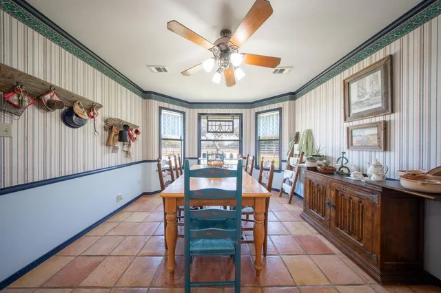 a kitchen with stainless steel appliances granite countertop a refrigerator a sink and a stove