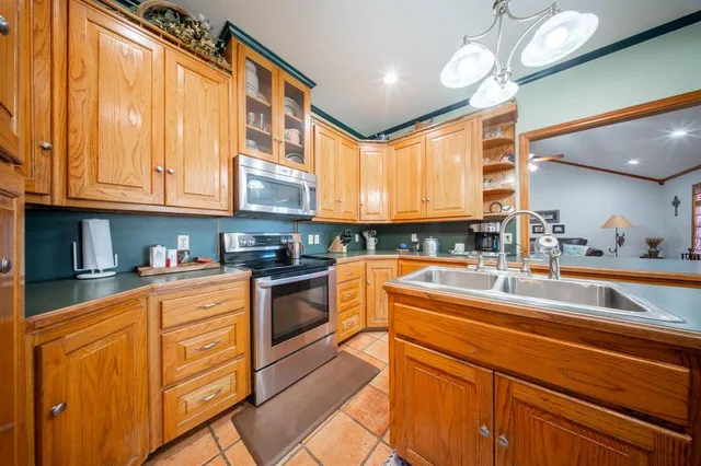 a bedroom with furniture and a chandelier