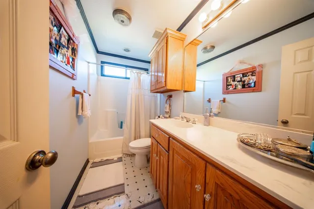 a bedroom with bed and a chandelier
