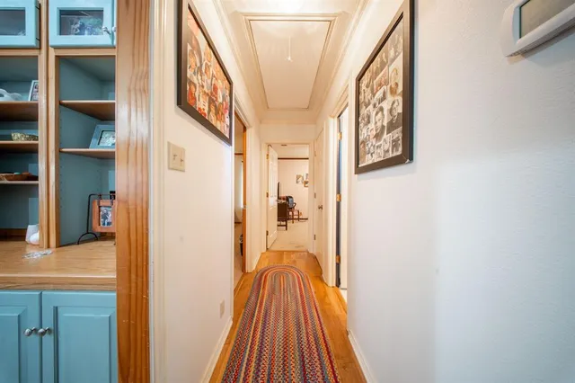 a spacious bedroom with a bed and a ceiling fan