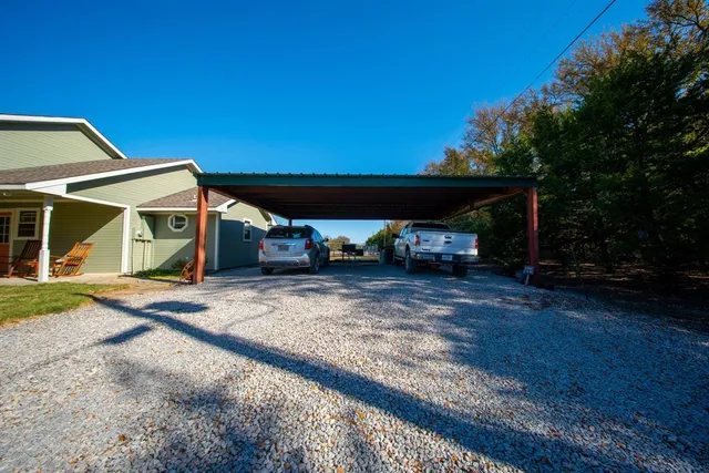 a view of yard with swimming pool and trees