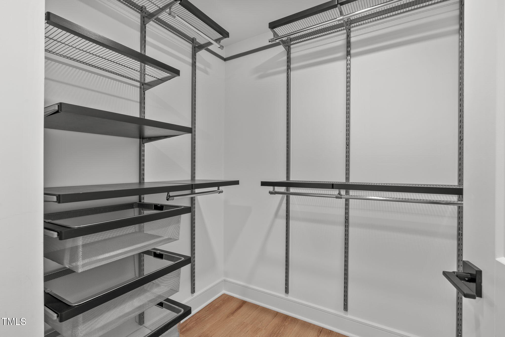 615 West Peace Street, Unit 302 Raleigh, NC 27605 - Photo 14 of 50 a view of walk in closet with empty racks