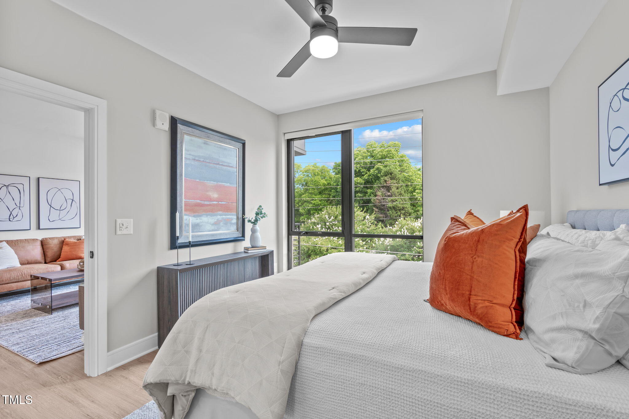 615 West Peace Street, Unit 302 Raleigh, NC 27605 - Photo 18 of 50 a bedroom with a bed and a large window