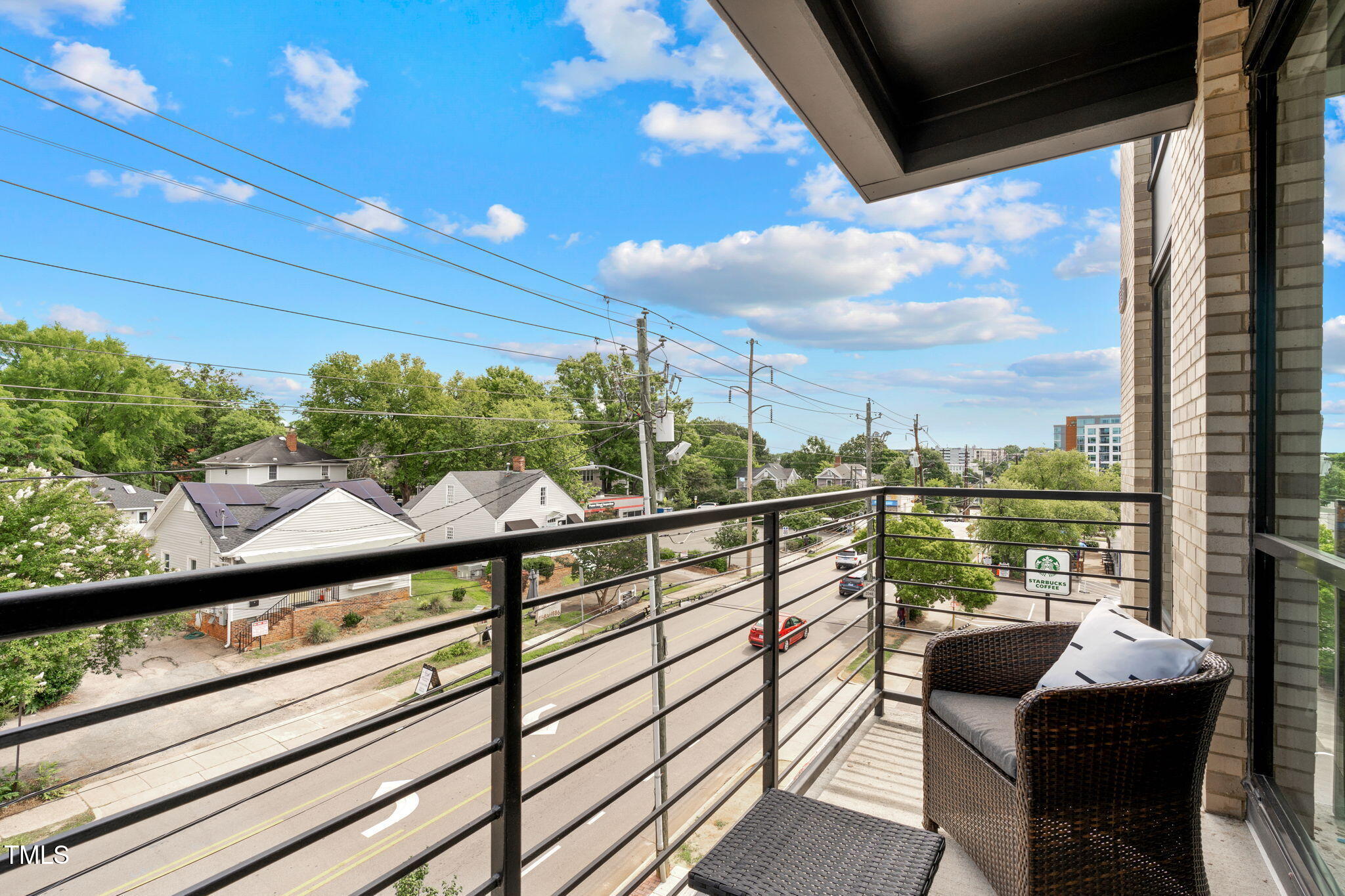 615 West Peace Street, Unit 302 Raleigh, NC 27605 - Photo 25 of 50 a view of a chairs and table in the balcony