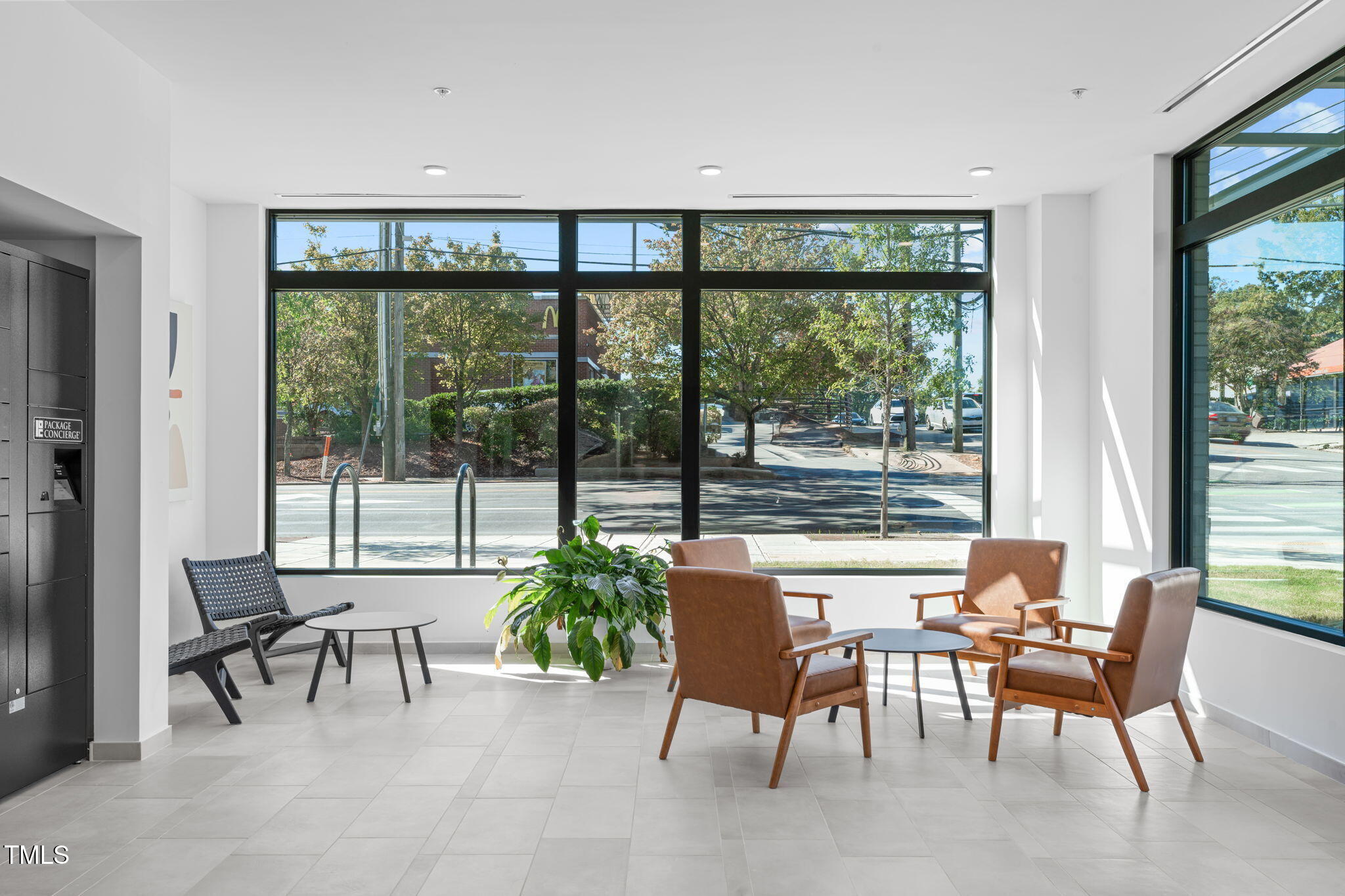 615 West Peace Street, Unit 302 Raleigh, NC 27605 - Photo 36 of 50 a dining room with furniture and a floor to ceiling window
