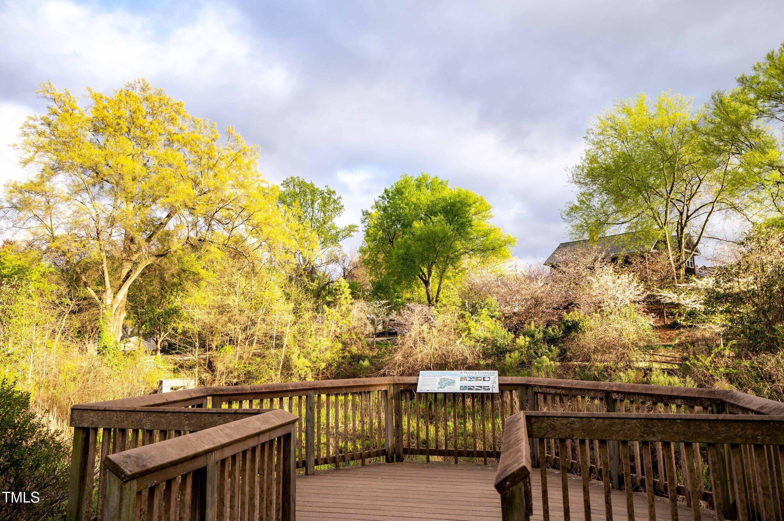 615 West Peace Street, Unit 302 Raleigh, NC 27605 - Photo 48 of 50 a view of a balcony with wooden fence
