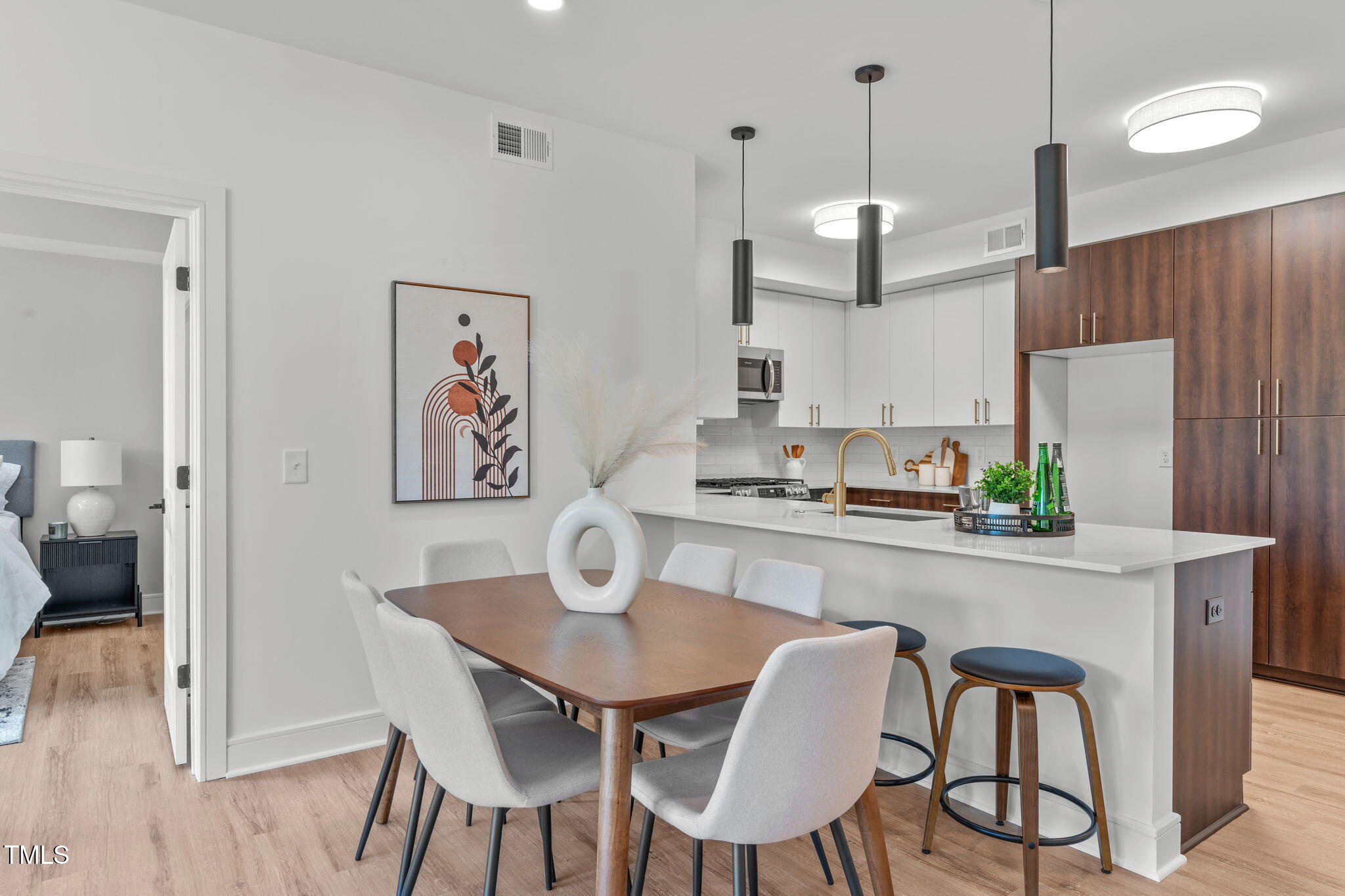 615 West Peace Street, Unit 302 Raleigh, NC 27605 - Photo 10 of 50 a view of kitchen and dining area with furniture