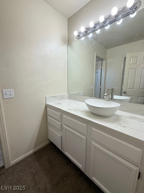 1719 Mesquite Court Henderson, NV 89014 - Photo 15 of 17 Bathroom featuring vanity and a textured wall