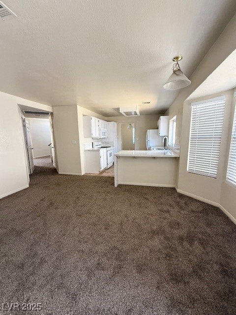 1719 Mesquite Court Henderson, NV 89014 - Photo 3 of 17 Unfurnished living room featuring carpet floors an