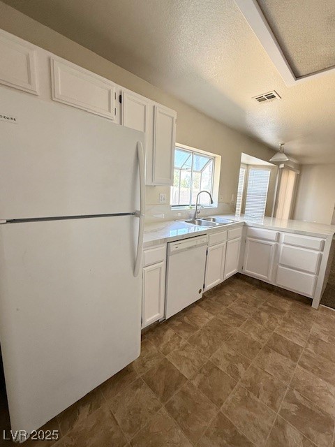 1719 Mesquite Court Henderson, NV 89014 - Photo 5 of 17 Kitchen with white appliances, a textured ceiling,