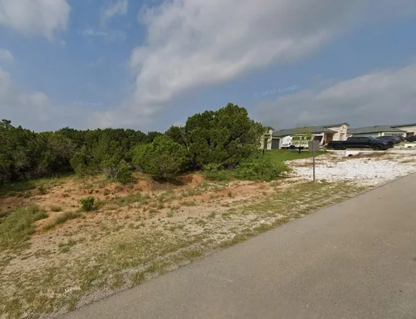 a view of a lake with a city