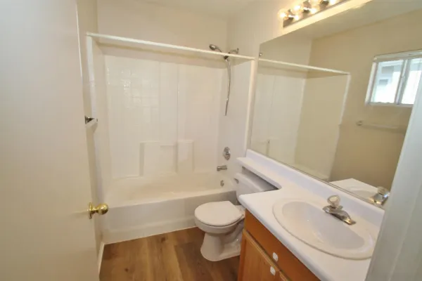a bathroom with a toilet a sink and a bathtub