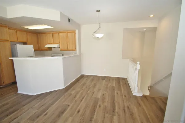 a view of kitchen with wooden floor and window