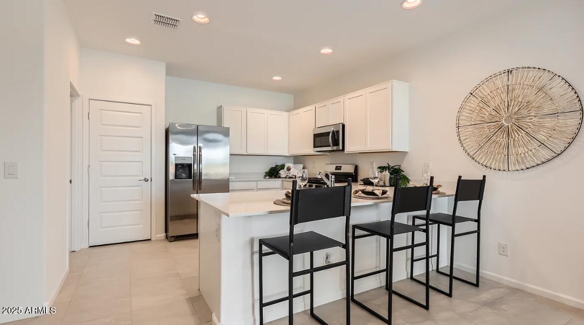 23407 West Bloch Road Buckeye, AZ 85326 - Photo 2 of 22 a view of a dining room with furniture