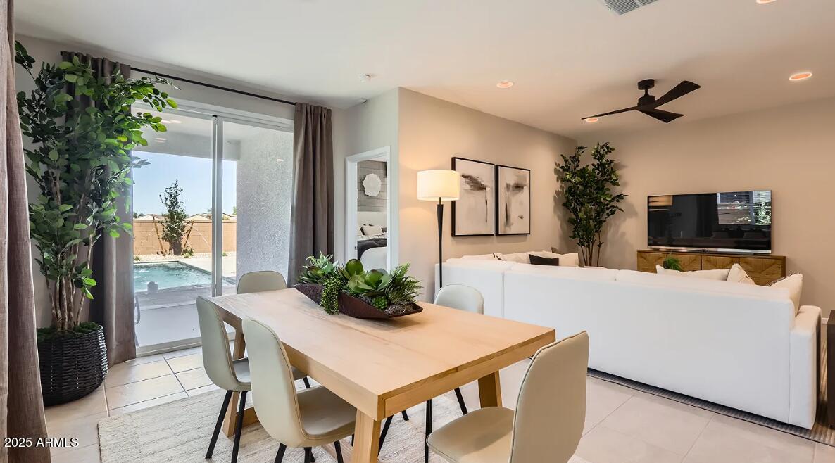 23407 West Bloch Road Buckeye, AZ 85326 - Photo 6 of 22 a living room with furniture and a flat screen tv